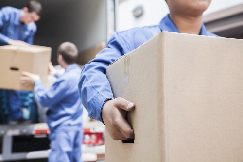 Moving van and boxes prepared for a Putney home relocation