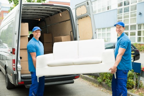Removal van outside a Putney apartment building during loading