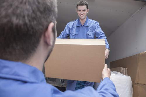 Mover carrying out a safe house removal with protective equipment
