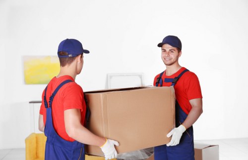 Professional loading of furniture into a moving truck in Putney