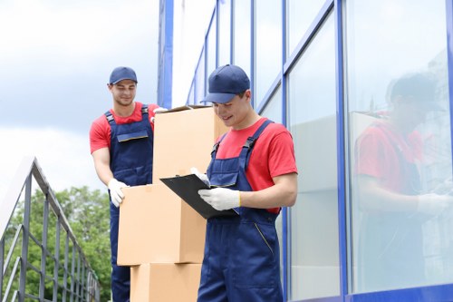 Office removals in Putney with team planning and moving boxes