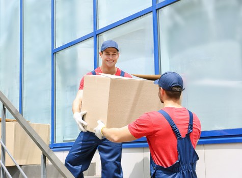 Local Putney man and van team handling boxes and furniture