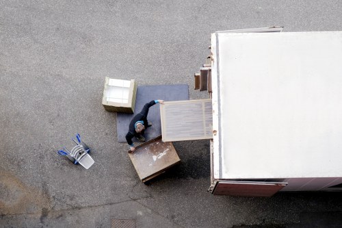 Packed office equipment prepared for commercial moves in Putney