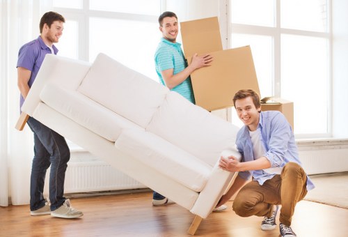 Professional moving van in Putney handling household items