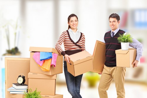 Professional movers transporting IT equipment during a Putney office move