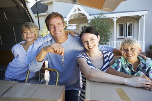 Movers handling office furniture during commercial moves in Putney