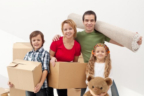 Household furniture and packed boxes ready for a home move in Putney