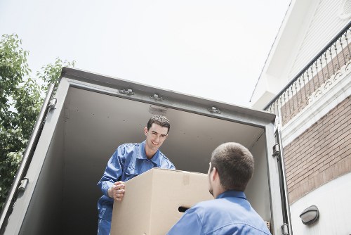 Man with van in Putney handling boxes and household items