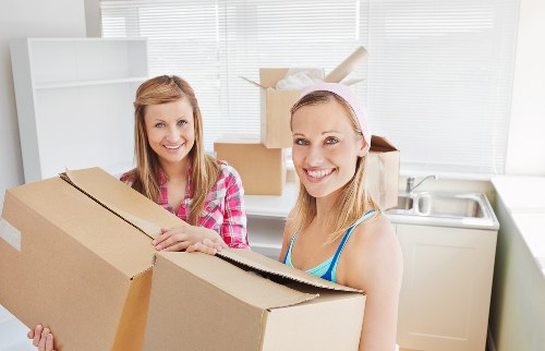Customer and removal crew reviewing terms before a man and van booking