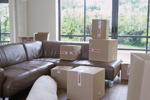 Local house removal team in Putney loading furniture into a van